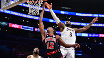 Mar 26, 2023; Los Angeles, California, USA; Los Angeles Lakers forward LeBron James (6) blocks the shot of Chicago Bulls guard Ayo Dosunmu (12) during the second half at Crypto.com Arena. Mandatory Credit: Gary A. Vasquez-USA TODAY Sports