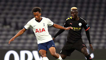 Tashan Oakley-Boothe of Tottenham Hotspur is challenged by Alpha Dionkou of Manchester City. (Photo by Jack Thomas/Getty Images)