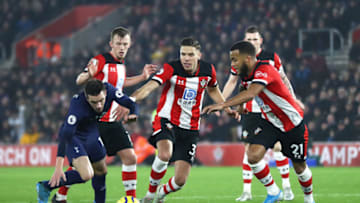 SOUTHAMPTON, ENGLAND - JANUARY 01: Giovani Lo Celso of Tottenham Hotspur battles for possession with James Ward-Prowse, Jan Bednarek and Ryan Bertrand of Southampton during the Premier League match between Southampton FC and Tottenham Hotspur at St Mary's Stadium on January 01, 2020 in Southampton, United Kingdom. (Photo by Michael Steele/Getty Images)