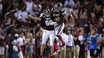 STARKVILLE, MS - OCTOBER 06: Joel Baldwin #66 of the Mississippi State Bulldogs and Tim Washington #50 celebrate a recovered fumble during the first half against the Auburn Tigers at Davis Wade Stadium on October 6, 2018 in Starkville, Mississippi. (Photo by Jonathan Bachman/Getty Images)