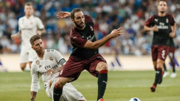 MADRID, SPAIN - AUGUST 11: Sergio Ramos of Real Madrid and Gonzalo Higuain of AC Milan battle for the ball during the Santiago Bernabeu trophy match between Real Madrid and AC Milan at Bernabeu on August 11, 2018 in Madrid, Spain. (Photo by TF-Images/Getty Images)