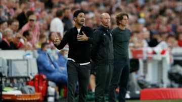 Arsenal's Spanish manager Mikel Arteta (L) gestures from the touchline during the English Premier League football match between Brentford and Arsenal at Brentford Community Stadium in London on August 13, 2021. - - RESTRICTED TO EDITORIAL USE. No use with unauthorized audio, video, data, fixture lists, club/league logos or 'live' services. Online in-match use limited to 120 images. An additional 40 images may be used in extra time. No video emulation. Social media in-match use limited to 120 images. An additional 40 images may be used in extra time. No use in betting publications, games or single club/league/player publications. (Photo by Adrian DENNIS / AFP) / RESTRICTED TO EDITORIAL USE. No use with unauthorized audio, video, data, fixture lists, club/league logos or 'live' services. Online in-match use limited to 120 images. An additional 40 images may be used in extra time. No video emulation. Social media in-match use limited to 120 images. An additional 40 images may be used in extra time. No use in betting publications, games or single club/league/player publications. / RESTRICTED TO EDITORIAL USE. No use with unauthorized audio, video, data, fixture lists, club/league logos or 'live' services. Online in-match use limited to 120 images. An additional 40 images may be used in extra time. No video emulation. Social media in-match use limited to 120 images. An additional 40 images may be used in extra time. No use in betting publications, games or single club/league/player publications. (Photo by ADRIAN DENNIS/AFP via Getty Images)
