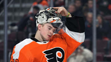 PHILADELPHIA, PA - JANUARY 14: Carter Hart #79 of the Philadelphia Flyers lifts his goaltending mask prior to the start of the second period against the Minnesota Wild on January 14, 2019 at the Wells Fargo Center in Philadelphia, Pennsylvania. (Photo by Len Redkoles/NHLI via Getty Images)
