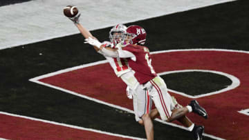 Alabama Crimson Tide defensive back Brian Branch (14) breaks up a pass intended for Ohio State Buckeyes wide receiver Jaxon Smith-Njigba (11) in the fourth quarter in the 2021 College Football Playoff National Championship Game at Hard Rock Stadium. Mandatory Credit: Douglas DeFelice-USA TODAY Sports