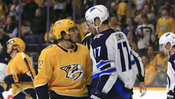 NASHVILLE, TN - OCTOBER 11: Nashville Predators left wing Kevin Fiala (22) confronts Winnipeg Jets center Adam Lowry (17) during the NHL game between the Nashville Predators and the Winnipeg Jets, held on October 11, 2018, at Bridgestone Arena in Nashville, Tennessee. (Photo by Danny Murphy/Icon Sportswire via Getty Images)
