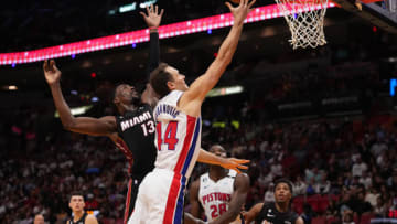 Detroit Pistons forward Bojan Bogdanovic (44) shoots the ball around Miami Heat center Bam Adebayo (13)(Jasen Vinlove-USA TODAY Sports)
