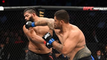 HOUSTON, TEXAS - FEBRUARY 08: (R-L) Justin Tafa of New Zealand punches Juan Adams in their heavyweight bout during the UFC 247 event at Toyota Center on February 08, 2020 in Houston, Texas. (Photo by Josh Hedges/Zuffa LLC via Getty Images)