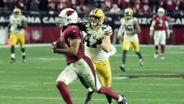 Jan 16, 2016; Glendale, AZ, USA; Arizona Cardinals wide receiver Larry Fitzgerald (11) runs with the ball in overtime against the Green Bay Packers in a NFC Divisional round playoff game at University of Phoenix Stadium. Mandatory Credit: Matt Kartozian-USA TODAY Sports