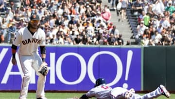 Aug 28, 2016; San Francisco, CA, USA; Atlanta Braves third baseman Adonis Garcia (13) head first slide into second base against San Francisco Giants shortstop Brandon Crawford (35) in the first inning at AT&T Park. Mandatory Credit: Neville E. Guard-USA TODAY Sports