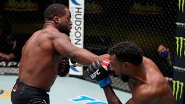 LAS VEGAS, NEVADA - DECEMBER 19: In this UFC handout, (L-R) Tafon Nchukwi of Cameroon punches Jamie Pickett in a middleweight fight during the UFC Fight Night event at UFC APEX on December 19, 2020 in Las Vegas, Nevada. (Photo by Cooper Neill/Zuffa LLC via Getty Images)