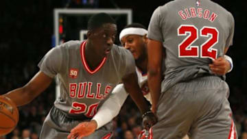 Dec 19, 2015; New York, NY, USA; Chicago Bulls forward Tony Snell (20) dribbles away from New York Knicks forward Carmelo Anthony (7) during second half at Madison Square Garden. The New York Knicks defeated the Chicago Bulls 107-91. Mandatory Credit: Noah K. Murray-USA TODAY Sports