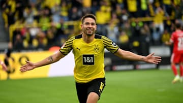 Raphael Guerreiro celebrates his goal against Union Berlin (Photo by INA FASSBENDER/AFP via Getty Images)