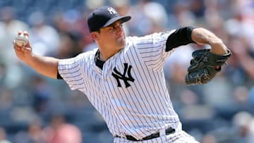 Jul 24, 2016; Bronx, NY, USA; New York Yankees starting pitcher Nathan Eovaldi (30) pitches against the San Francisco Giants during the first inning at Yankee Stadium. Mandatory Credit: Brad Penner-USA TODAY Sports