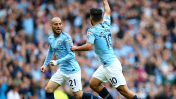 MANCHESTER, ENGLAND - AUGUST 19: Sergio Aguero of Manchester City celebrates with teammate David Silva after scoring his team's first goal during the Premier League match between Manchester City and Huddersfield Town at Etihad Stadium on August 19, 2018 in Manchester, United Kingdom. (Photo by Alex Livesey/Getty Images)