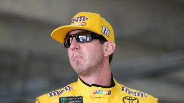CHARLOTTE, NORTH CAROLINA - MAY 23: Kyle Busch, driver of the #18 M&M's Red White & Blue Toyota, looks on in the garage during practice for the Monster Energy NASCAR Cup Series Coca-Cola 600 at Charlotte Motor Speedway on May 23, 2019 in Charlotte, North Carolina. (Photo by Streeter Lecka/Getty Images)