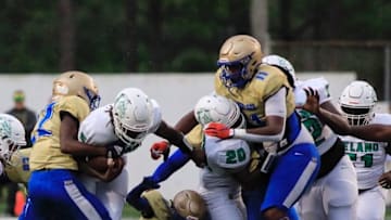 Auburn footballMainland defensive lineman LJ McCray (11) pursues DeLand's TJ Moore (5) during the first quarter, Friday, Aug. 26, 2022.Deland Mainland 3