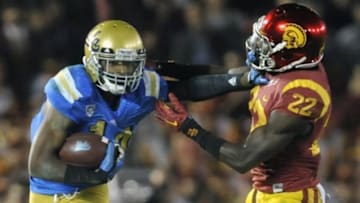 November 22, 2014; Pasadena, CA, USA; UCLA Bruins wide receiver Mossi Johnson (14) runs the ball against the Southern California Trojans during the second half at the Rose Bowl. Mandatory Credit: Gary A. Vasquez-USA TODAY Sports