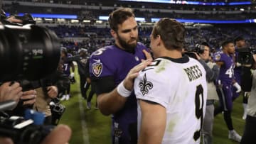 BALTIMORE, MD - OCTOBER 21: Quarterback Joe Flacco #5 of the Baltimore Ravens and quarterback Drew Brees #9 of the New Orleans Saints talk after the New Orleans Saints beat the Baltimore Ravens 24-23 at M&T Bank Stadium on October 21, 2018 in Baltimore, Maryland. (Photo by Rob Carr/Getty Images)