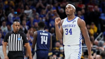 INDIANAPOLIS, INDIANA - MARCH 17: Oscar Tshiebwe #34 of the Kentucky Wildcats celebrates a play against the Saint Peter's Peacocks during the second half in the first round game of the 2022 NCAA Men's Basketball Tournament at Gainbridge Fieldhouse on March 17, 2022 in Indianapolis, Indiana. (Photo by Andy Lyons/Getty Images)