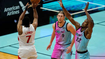 Toronto Raptors guard Kyle Lowry (7) shoots the ball over Miami Heat forward Jimmy Butler (22) and forward Kelly Olynyk (9) (Jasen Vinlove-USA TODAY Sports)