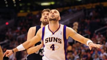 Jan. 28, 2012; Phoenix, AZ, USA; Phoenix Suns center Marcin Gortat (4) against Memphis Grizzlies center Marc Gasol at the US Airways Center. The Suns defeated the Grizzlies 86-84. Mandatory Credit: Mark J. Rebilas-USA TODAY Sports