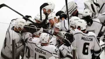 Jun 1, 2014; Chicago, IL, USA; (EDITORS NOTE: caption correction due to official scoring change) Los Angeles Kings defenseman Alec Martinez (27) is congratulated by his teammates after scoring the game-winning goal against the Chicago Blackhawks during the overtime period in game seven of the Western Conference Final of the 2014 Stanley Cup Playoffs at United Center. Mandatory Credit: Dennis Wierzbicki-USA TODAY Sports