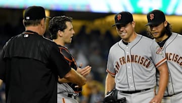 Aug 25, 2016; Los Angeles, CA, USA; San Francisco Giants catcher Buster Posey (28) and shortstop Brandon Crawford (35) look on as starting pitcher Matt Moore (45) is taken out of the game by manager Bruce Bochy (15) as he came up one out short of a no hitter giving up a single to Los Angeles Dodgers shortstop Corey Seager (5) in the ninth inning of the game at Dodger Stadium. Mandatory Credit: Jayne Kamin-Oncea-USA TODAY Sports