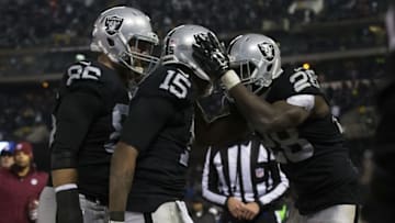 Dec 24, 2015; Oakland, CA, USA; Oakland Raiders wide receiver Michael Crabtree (15) celebrates with running back Latavius Murray (28) and tight end Lee Smith (86) after a touchdown against the San Diego Chargers during the fourth quarter at O.co Coliseum. The Oakland Raiders defeated the San Diego Chargers 23-20. Mandatory Credit: Kelley L Cox-USA TODAY Sports