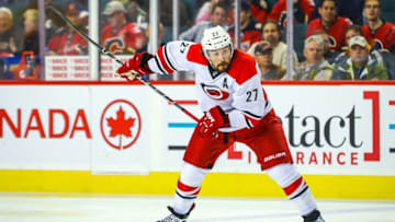 Oct 20, 2016; Calgary, Alberta, CAN; Carolina Hurricanes defenseman Justin Faulk (27) shoot the puck against Calgary Flames during the second period at Scotiabank Saddledome. Mandatory Credit: Sergei Belski-USA TODAY Sports