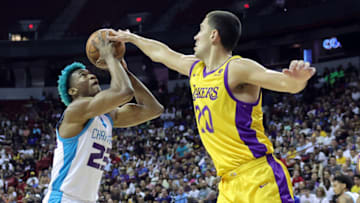 LAS VEGAS, NEVADA - JULY 09: Kai Jones #23 of the Charlotte Hornets shoots against Cole Swider #20 of the Los Angeles Lakers in the first half of a 2023 NBA Summer League game at the Thomas & Mack Center on July 09, 2023 in Las Vegas, Nevada. NOTE TO USER: User expressly acknowledges and agrees that, by downloading and or using this photograph, User is consenting to the terms and conditions of the Getty Images License Agreement. (Photo by Ethan Miller/Getty Images)