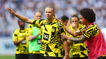 DORTMUND, GERMANY - MAY 14: Erling Haaland of Borussia Dortmund acknowledges the fans next to teammate Axel Witsel prior to the Bundesliga match between Borussia Dortmund and Hertha BSC at Signal Iduna Park on May 14, 2022 in Dortmund, Germany. (Photo by Lars Baron/Getty Images)