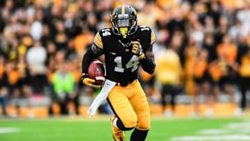 Oct 1, 2016; Iowa City, IA, USA; Iowa Hawkeyes defensive back Desmond King (14) returns a punt against the Northwestern Wildcats during the first quarter at Kinnick Stadium. Mandatory Credit: Jeffrey Becker-USA TODAY Sports