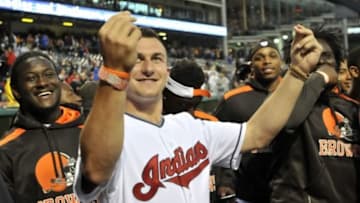 Jun 4, 2014; Cleveland, OH, USA; Cleveland Browns quarterback Johnny Manziel and other team rookies react while they are introduced before a game between the Cleveland Indians and the Boston Red Sox at Progressive Field. Mandatory Credit: David Richard-USA TODAY Sports