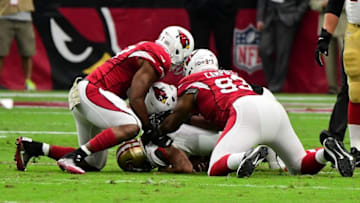Nov 13, 2016; Glendale, AZ, USA; San Francisco 49ers quarterback Colin Kaepernick (7) is sacked by Arizona Cardinals linebacker Chandler Jones (55), defensive tackle Calais Campbell (93) and linebacker Alex Okafor (57) during the first half at University of Phoenix Stadium. Mandatory Credit: Matt Kartozian-USA TODAY Sports