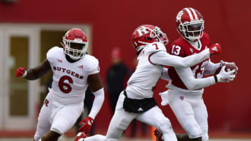 Nov 13, 2021; Bloomington, Indiana, USA; Indiana Hoosiers wide receiver Miles Marshall (13) is tackled by Rutgers Scarlet Knights defensive back Robert Longerbeam (7) during the second half at Memorial Stadium. The Scarlet Knights won 38-3. Mandatory Credit: Marc Lebryk-USA TODAY Sports