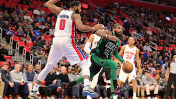 DETROIT, MI - DECEMBER 10: Kyrie Irving #11 of the Boston Celtics drives to the basket against Andre Drummond #0 of the Detroit Pistons at Little Caesars Arena on December 10, 2017 in Detroit, Michigan. NOTE TO USER: User expressly acknowledges and agrees that, by downloading and or using this photograph, User is consenting to the terms and conditions of the Getty Images License Agreement. (Photo by Rey Del Rio/Getty Images)
