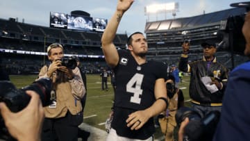 Dec 4, 2016; Oakland, CA, USA; Oakland Raiders quarterback Derek Carr (4) waves to the crowd after the Raiders defeated the Buffalo Bills 38-24 at Oakland Coliseum. Mandatory Credit: Cary Edmondson-USA TODAY Sports