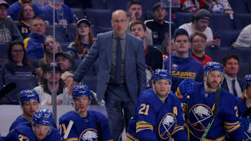 Apr 5, 2022; Buffalo, New York, USA; Buffalo Sabres head coach Dan Granato watches his team play during the second period against the Carolina Hurricanes at KeyBank Center. Mandatory Credit: Timothy T. Ludwig-USA TODAY Sports