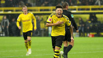 DORTMUND, GERMANY - DECEMBER 17: Jadon Sancho of Borussia Dortmund celebrates after scoring his team's third goal during the Bundesliga match between Borussia Dortmund and RB Leipzig at Signal Iduna Park on December 17, 2019 in Dortmund, Germany. (Photo by Lars Baron/Bongarts/Getty Images)