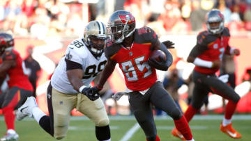 TAMPA, FL - DECEMBER 31: Wide receiver Bobo Wilson #85 of the Tampa Bay Buccaneers evades defensive tackle Sheldon Rankins #98 of the New Orleans Saints as he runs the ball during the first quarter of an NFL football game on December 31, 2017 at Raymond James Stadium in Tampa, Florida. (Photo by Brian Blanco/Getty Images)