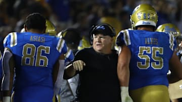 PASADENA, CA - OCTOBER 20: Head coach Chip Kelly of the UCLA Bruins congratulates his players after his team scored a touchdown during the first half of the NCAA college football game against the Arizona Wildcats at the Rose Bowl on October 20, 2018 in Pasadena, California. (Photo by Victor Decolongon/Getty Images)