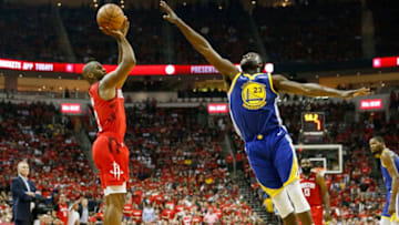 OKC Thunder: Chris Paul #3 takes a three point shot defended by Draymond Green. (Photo by Tim Warner/Getty Images)