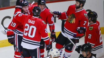 Dec 21, 2014; Chicago, IL, USA; Chicago Blackhawks center Jonathan Toews (19) celebrates after scoring against the Toronto Maple Leafs with teammates during the third period of their NHL game at United Center. Blackhawks won 4-0. Mandatory Credit: Kamil Krzaczynski-USA TODAY Sports