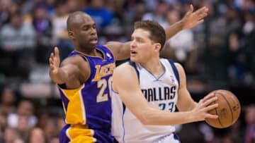 Jan 7, 2014; Dallas, TX, USA; Los Angeles Lakers shooting guard Jodie Meeks (20) defends Dallas Mavericks point guard Gal Mekel (33) during the second half at the American Airlines Center. The Mavericks won 110-97. Meeks leads his team with 24 points. Mandatory Credit: Jerome Miron-USA TODAY Sports