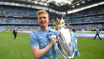Kevin De Bruyne celebrates with the Premier League trophy after their side finished the season as Premier League champions during match between Manchester City and Aston Villa at Etihad Stadium on May 22, 2022 in Manchester, England. (Photo by Michael Regan/Getty Images)