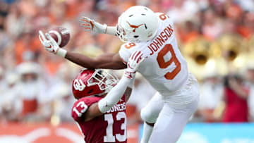 DALLAS, TX - OCTOBER 06: Tre Norwood #13 of the Oklahoma Sooners is called for pass interference on a pass intended for Collin Johnson #9 of the Texas Longhorns in the fourth quarter of the 2018 AT&T Red River Showdown at Cotton Bowl on October 6, 2018 in Dallas, Texas. (Photo by Tom Pennington/Getty Images)