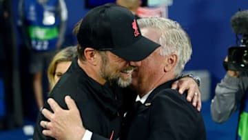 PARIS, FRANCE - MAY 28: Coach Carlo Ancelotti of Real Madrid CF hugs Coach Jürgen Klopp of Liverpool FC prior to the UEFA Champions League final between Liverpool FC and Real Madrid at Stade de France on May 28, 2022 in Paris, France. (Photo by Mattia Ozbot/Getty Images)