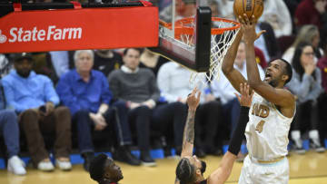 Cleveland Cavaliers forward Evan Mobley (4) shoots beside Miami Heat forward Caleb Martin (16) and guard Victor Oladipo (4) in the fourth quarter(David Richard-USA TODAY Sports)