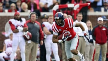 Nov 9, 2013; Oxford, MS, USA; Mississippi Rebels wide receiver Donte Moncrief (12) advances the ball during the game against the Arkansas Razorbacks at Vaught-Hemingway Stadium. Mississippi Rebels defeat the Arkansas Razorbacks with a score of 34-24. Mandatory Credit: Spruce Derden-USA TODAY Sports