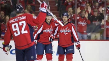 Jan 10, 2016; Washington, DC, USA; Washington Capitals right wing Justin Williams (14), left wing Andre Burakovsky (65) and center Evgeny Kuznetsov (92) celebrate a a game against the Ottawa Senators during the first period at Verizon Center. Mandatory Credit: Rafael Suanes-USA TODAY Sports